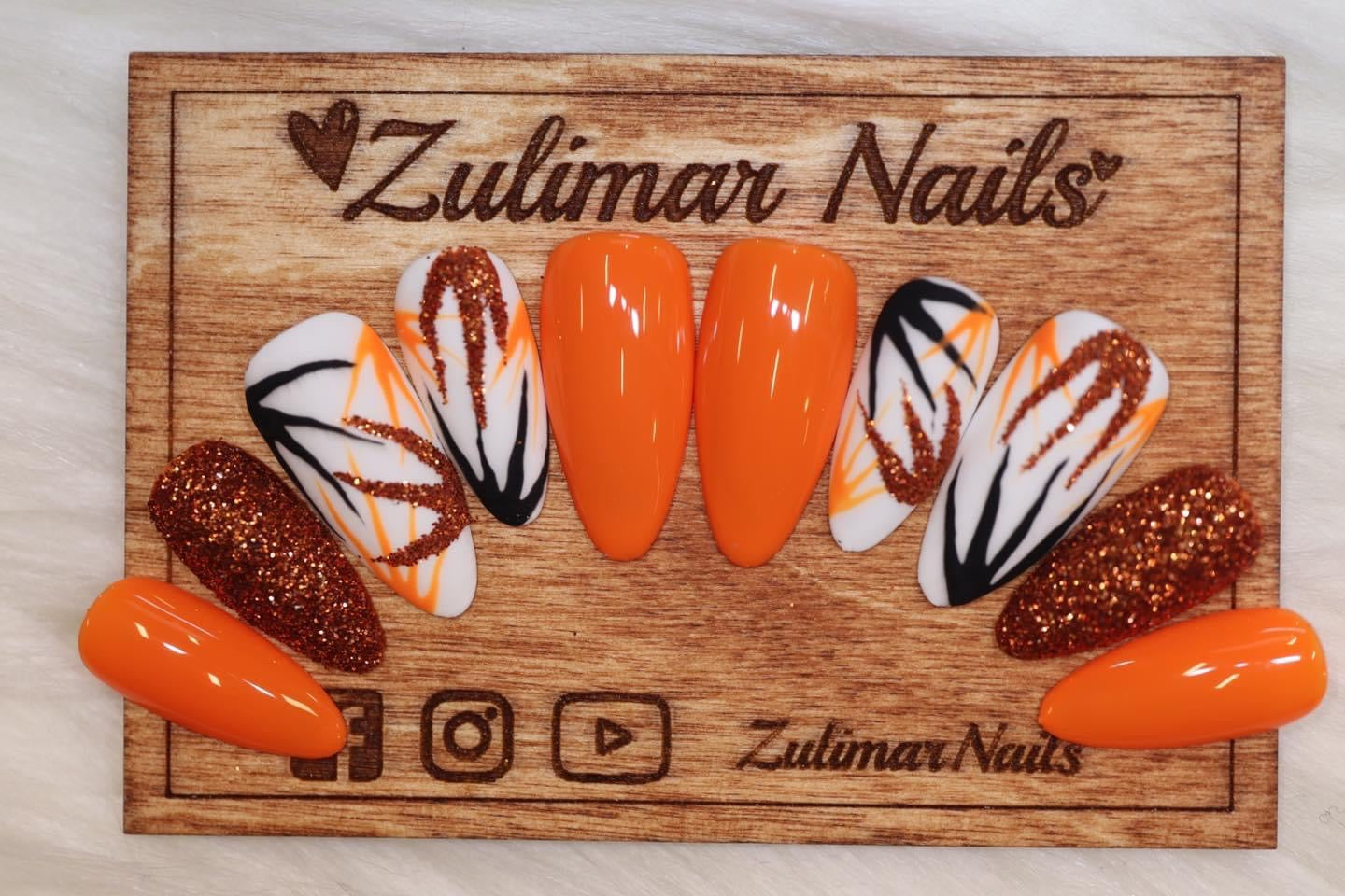 ORANGE WHITE BLACK NAIL DESIGN